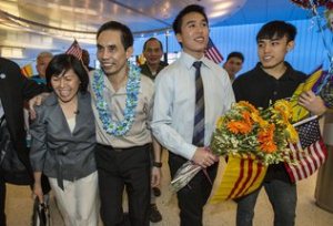 Dr. Nguyen Quoc Quan returns home. Photo by Ringo H.W. Chiu / AP.
