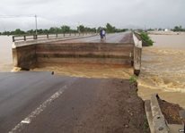 A bridge damaged by flooding caused by a storm