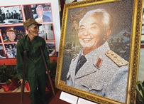 Soldier paying tribute to Gen. Vo Nguyen Giap