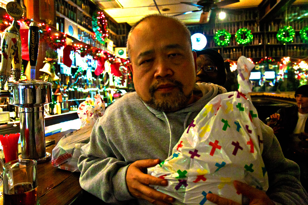 Linh Dinh in Jack's Bar with Christmas care package