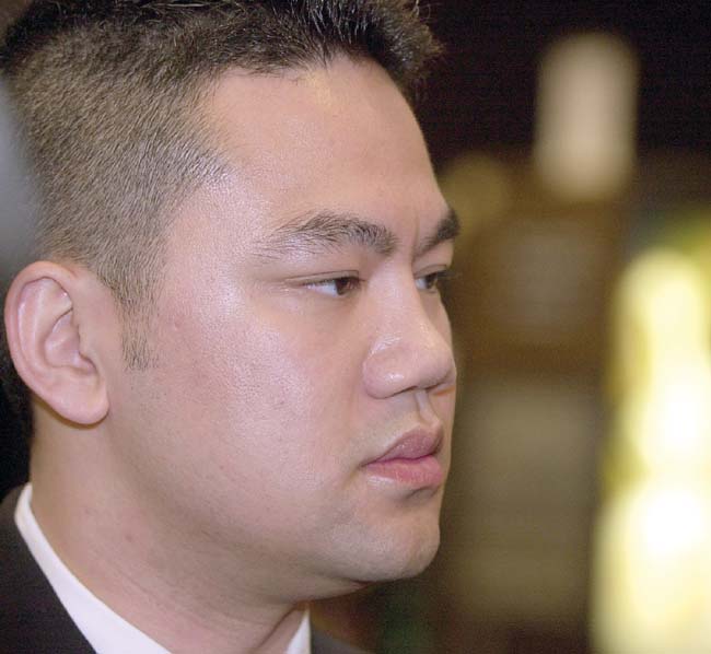Minneapolis police officer Duy Ngo speaks with reporters during an awards ceremony in which Ngo was presented with a Recognition of Service Award by St. Paul Mayor Randy Kelly on June 7, 2003. Ngo was shot by a suspect and fellow officer Feb. 25, 2003. (Pioneer Press file photo)